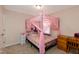 Charming bedroom featuring a canopy bed with a whimsical pink theme at 313 Kineton Woods Way Way, Garner, NC 27529