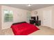 Spacious bedroom with two windows and a desk at 313 Kineton Woods Way Way, Garner, NC 27529