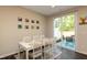 Sunlit dining room with sliding doors to a private outdoor patio at 313 Kineton Woods Way Way, Garner, NC 27529