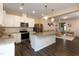 A well-equipped kitchen featuring stainless steel appliances, granite countertops and island at 313 Kineton Woods Way Way, Garner, NC 27529