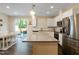A well-equipped kitchen featuring stainless steel appliances and granite countertops with seating at 313 Kineton Woods Way Way, Garner, NC 27529