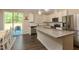 A well-equipped kitchen featuring stainless steel appliances and granite countertops at 313 Kineton Woods Way Way, Garner, NC 27529