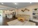 Bright living room with modern furnishings next to a spacious kitchen at 313 Kineton Woods Way Way, Garner, NC 27529