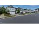 A wide street view of a well-planned neighborhood with sidewalks and street parking at 313 Kineton Woods Way Way, Garner, NC 27529