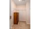 Spacious walk-in closet with carpeted floors, shelving, and a wooden dresser for ample storage at 313 Kineton Woods Way Way, Garner, NC 27529
