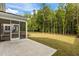A screened porch and patio provide ample room for outdoor living in the grassy backyard at 323 Oak Branch Trl, Garner, NC 27529