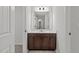 Bathroom featuring vanity with a large mirror and lighting at 323 Oak Branch Trl, Garner, NC 27529