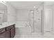The bathroom features modern shower and soaking tub at 323 Oak Branch Trl, Garner, NC 27529