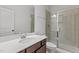 Bathroom features a glass-enclosed shower and modern vanity at 323 Oak Branch Trl, Garner, NC 27529