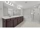 A bright primary bathroom features double sinks, a soaking tub, and separate shower at 323 Oak Branch Trl, Garner, NC 27529
