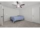 A tidy bedroom offers a comfortable bed, ceiling fan, and neutral decor, ideal for a peaceful retreat at 323 Oak Branch Trl, Garner, NC 27529