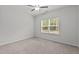Bedroom showcasing a window and ceiling fan at 323 Oak Branch Trl, Garner, NC 27529