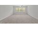 Spacious bedroom with natural light coming through the window at 323 Oak Branch Trl, Garner, NC 27529