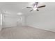 Large, open bonus room with carpet flooring and ample natural light at 323 Oak Branch Trl, Garner, NC 27529
