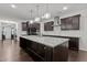 Spacious kitchen featuring a large island, stainless steel appliances, and ample cabinet space at 323 Oak Branch Trl, Garner, NC 27529