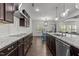 Modern kitchen with sleek countertops, stainless steel appliances, and ample storage at 323 Oak Branch Trl, Garner, NC 27529