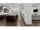 Modern kitchen with granite countertops, stainless steel appliances, and a large island at 323 Oak Branch Trl, Garner, NC 27529
