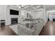 Cozy living room featuring a fireplace, plush seating, and an open concept design at 323 Oak Branch Trl, Garner, NC 27529