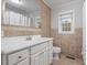 Bathroom featuring a large mirror, single sink vanity, and tiled floors at 3402 Pat Tilley Rd, Bahama, NC 27503