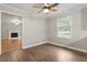 Bedroom has hard surface floors and a view to the fireplace in the next room at 3402 Pat Tilley Rd, Bahama, NC 27503