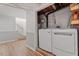 Laundry room featuring a washer and dryer with stairs leading to another level at 3402 Pat Tilley Rd, Bahama, NC 27503
