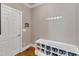 Entryway features a built-in storage bench, shoe storage and wood floors at 3824 Laurel Hills Rd, Raleigh, NC 27612