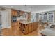 Gourmet kitchen with center island, double ovens, custom cabinets, and breakfast nook at 3824 Laurel Hills Rd, Raleigh, NC 27612