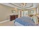 Bright main bedroom with a dresser and an ensuite bathroom featuring a glass-enclosed shower at 3824 Laurel Hills Rd, Raleigh, NC 27612