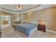 Main bedroom features a tray ceiling, sitting area and en-suite bathroom at 3824 Laurel Hills Rd, Raleigh, NC 27612