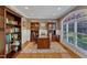 Beautiful office with hardwood floors, wainscoting, built in shelving, and a large window at 3824 Laurel Hills Rd, Raleigh, NC 27612