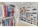 Walk-in closet with ample shelving and hanging space, perfect for organization and storage at 3824 Laurel Hills Rd, Raleigh, NC 27612