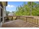 Spacious wood deck overlooks the home's fenced backyard and lush green trees at 3866 Keohane Dr, Durham, NC 27705