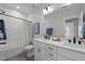 Bright bathroom featuring a double vanity, modern fixtures, and a shower-tub combination at 3866 Keohane Dr, Durham, NC 27705
