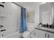 Modern bathroom showcasing a shower with white subway tile and vanity with dark hardware at 3866 Keohane Dr, Durham, NC 27705