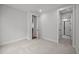 Bright bedroom features neutral walls, plush carpeting, and doorway views to other rooms at 3866 Keohane Dr, Durham, NC 27705