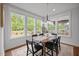 Bright dining room with large windows and a view of the backyard at 3866 Keohane Dr, Durham, NC 27705