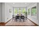 Cozy dining room filled with natural light from the large windows at 3866 Keohane Dr, Durham, NC 27705