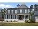 Charming two-story home with a covered front porch and beautifully landscaped front yard at 3866 Keohane Dr, Durham, NC 27705