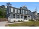 Exterior view showcases a well-maintained front yard and charming two-story facade at 3866 Keohane Dr, Durham, NC 27705