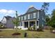 Exterior showcases a manicured front lawn and charming two-story facade at 3866 Keohane Dr, Durham, NC 27705