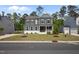Exterior front view showcasing a manicured lawn and a charming two-story façade at 3866 Keohane Dr, Durham, NC 27705