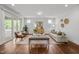 Inviting living room with access to the outdoor deck, hardwood floors and natural light at 3866 Keohane Dr, Durham, NC 27705