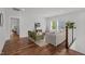 Upstairs living room features hardwood flooring, comfortable seating, and natural lighting at 3866 Keohane Dr, Durham, NC 27705