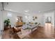 Bright living room with hardwood floors, stylish decor, and natural light at 3866 Keohane Dr, Durham, NC 27705