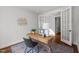 Well-lit home office featuring a modern desk, neutral walls, and decorative accents at 3866 Keohane Dr, Durham, NC 27705