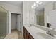 Primary bathroom suite with double sink vanity, linen closet and separate shower at 406 N Wakefield St, Zebulon, NC 27597