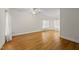 An empty primary bedroom featuring hardwood floors and bright, natural light at 406 N Wakefield St, Zebulon, NC 27597