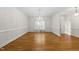Elegant dining room featuring hardwood floors, large window and chandelier at 406 N Wakefield St, Zebulon, NC 27597