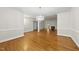 Bright living room with fireplace, hardwood floors, and elegant chandelier at 406 N Wakefield St, Zebulon, NC 27597
