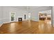 Comfortable living room featuring hardwood floors, fireplace, and open layout to the kitchen at 406 N Wakefield St, Zebulon, NC 27597